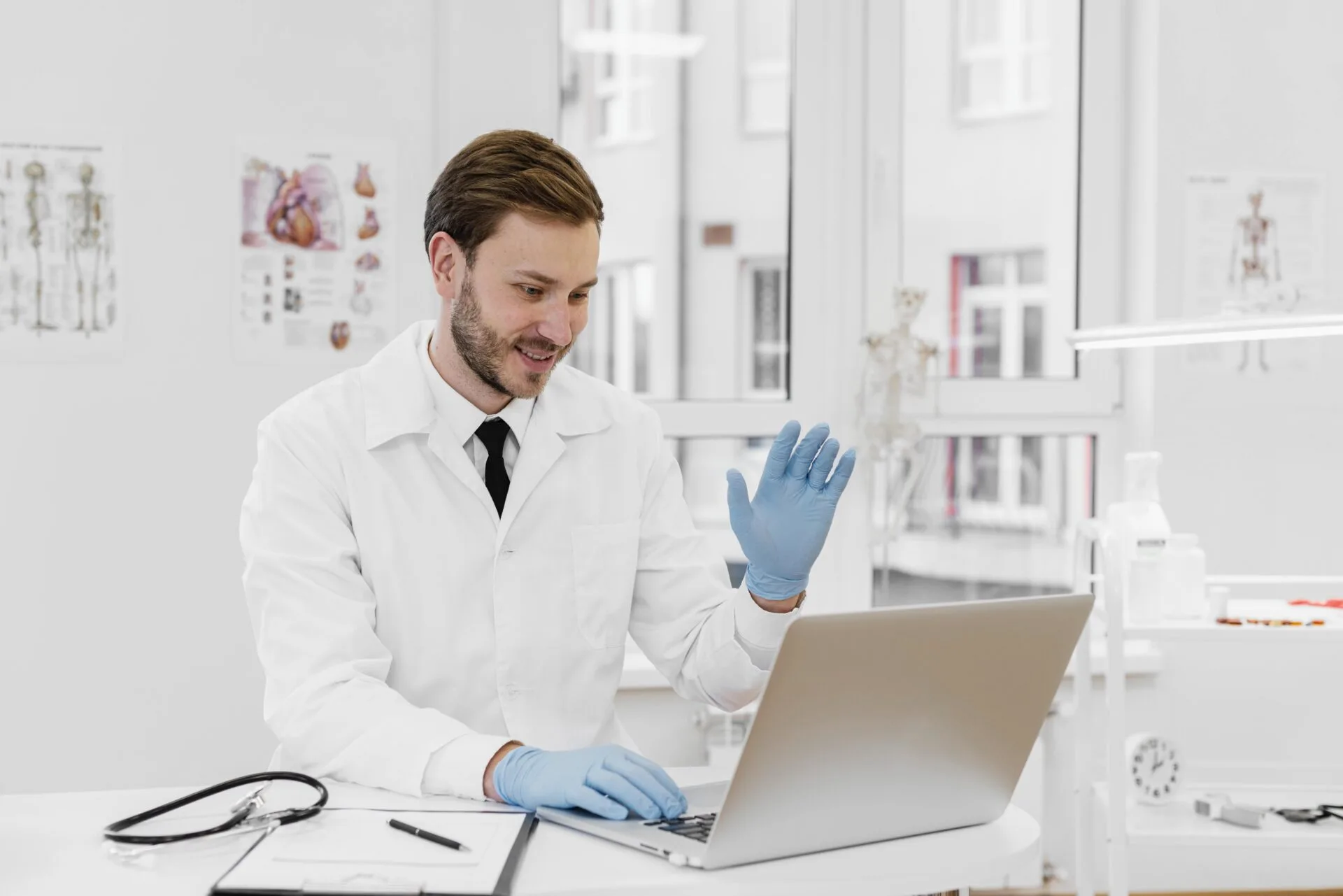 medium-shot-doctor-working-laptop